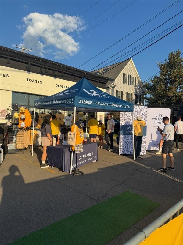 Legacy Headwear booth at University of Michigan football game